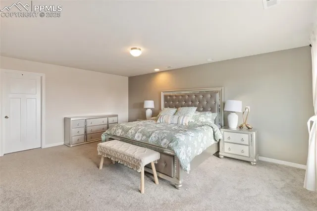 a bedroom with a bed and a chair