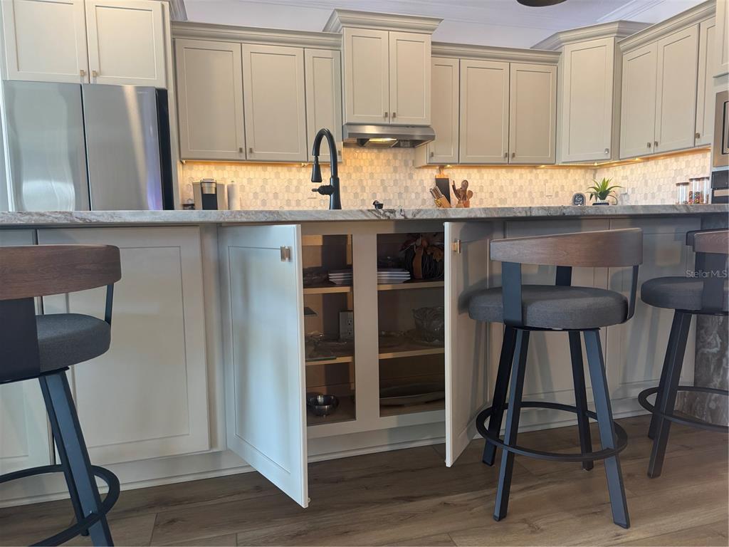 9232 Southwest 85th Place Ocala, FL 34481 - Photo 12 of 38 a kitchen with stainless steel appliances granite countertop a stove top oven a sink and a refrigerator