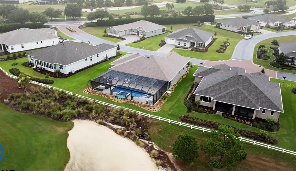 9232 Southwest 85th Place Ocala, FL 34481 - Photo 2 of 38 an aerial view of a house with outdoor space and a lake view