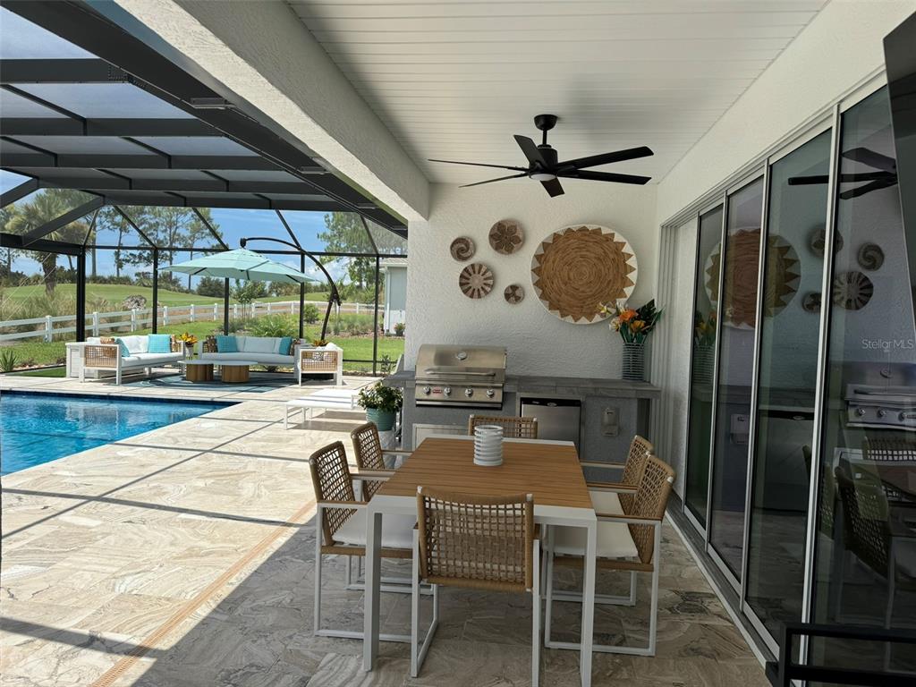 9232 Southwest 85th Place Ocala, FL 34481 - Photo 31 of 38 a patio with a table and chairs