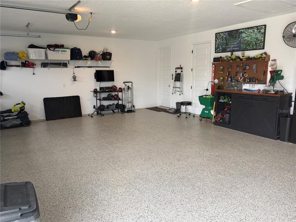 9232 Southwest 85th Place Ocala, FL 34481 - Photo 37 of 38 a living room with furniture and a flat screen tv