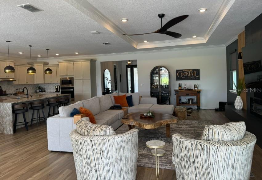 9232 Southwest 85th Place Ocala, FL 34481 - Photo 6 of 38 a living room with furniture and wooden floor