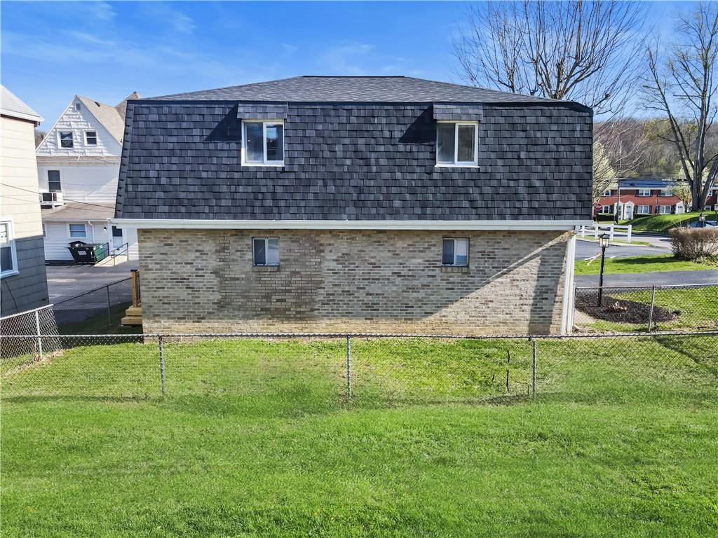 116 4th Street McDonald, PA 15057 - Photo 15 of 16 a front view of a house with a garden