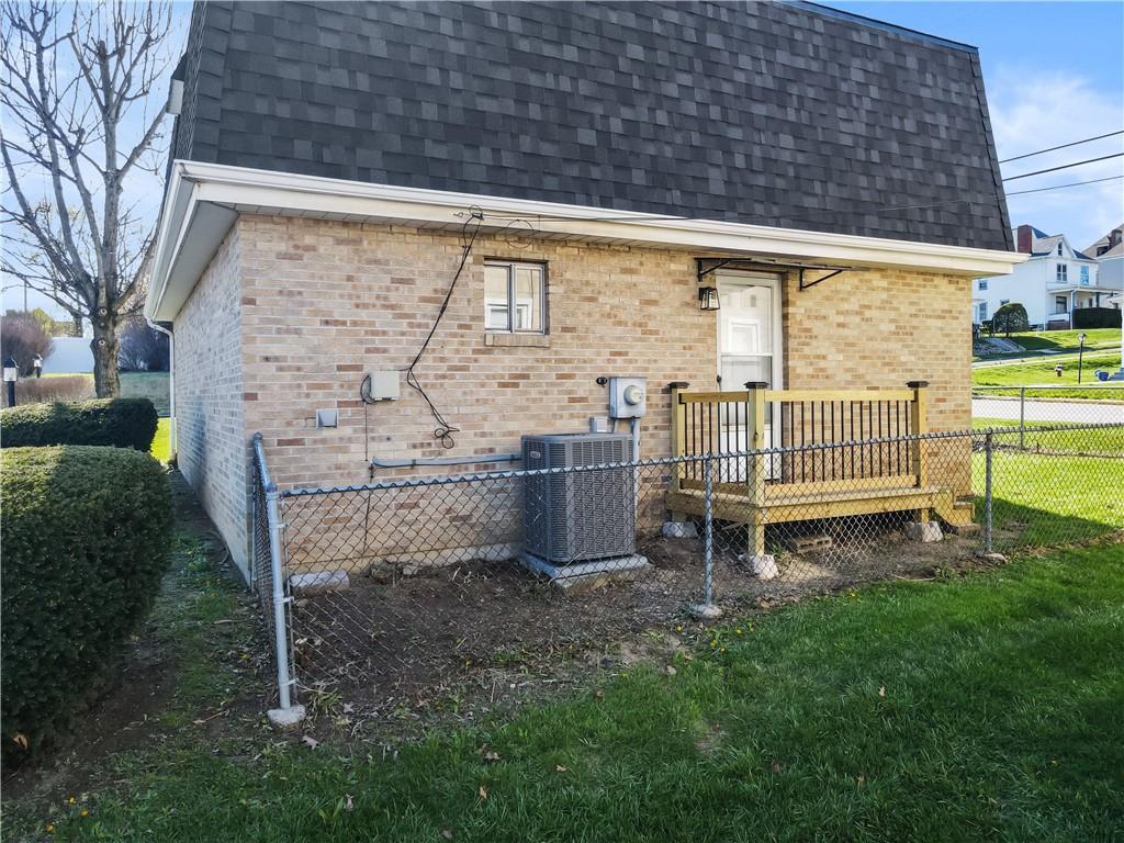 116 4th Street McDonald, PA 15057 - Photo 16 of 16 a backyard of a house with a garden and outdoor seating