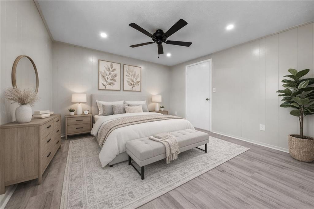 116 4th Street McDonald, PA 15057 - Photo 9 of 16 a spacious bedroom with a bed and a potted plant