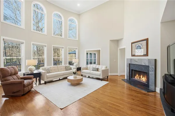 a spacious bedroom with a bed and a table