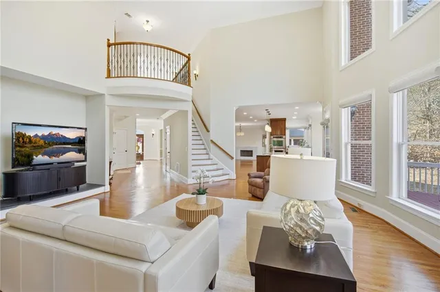 a bathroom with a granite countertop bathtub shower and toilet