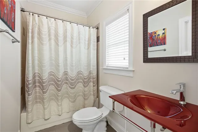 a large bathroom with a large mirror vanity and shower