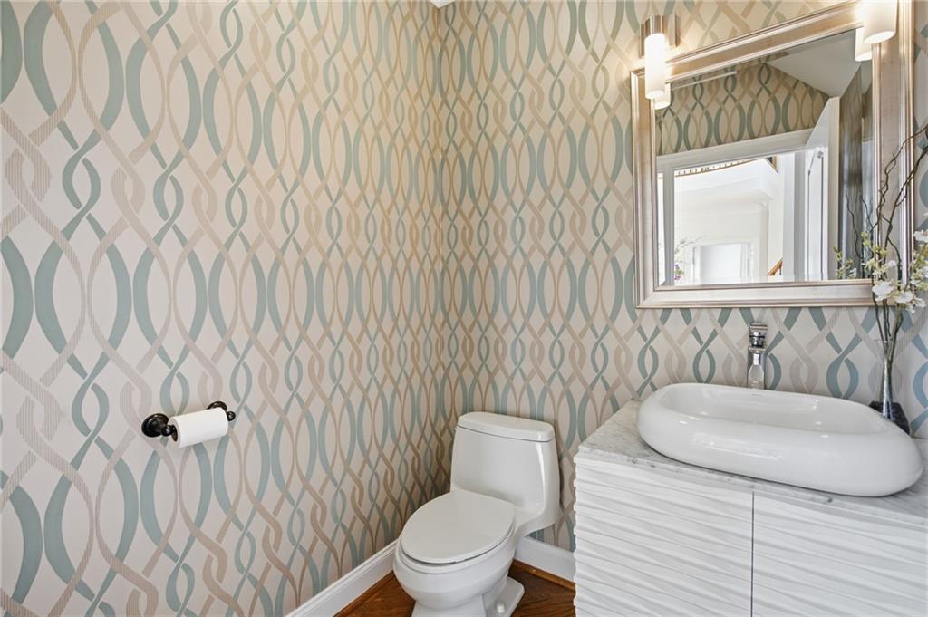 715 Crown Cove Milton, GA 30004 - Photo 28 of 102 a bathroom with a toilet and a sink