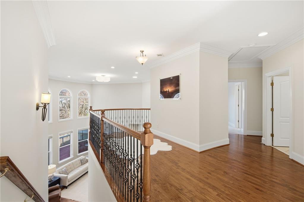 715 Crown Cove Milton, GA 30004 - Photo 30 of 102 a view of a hallway with wooden floor and windows