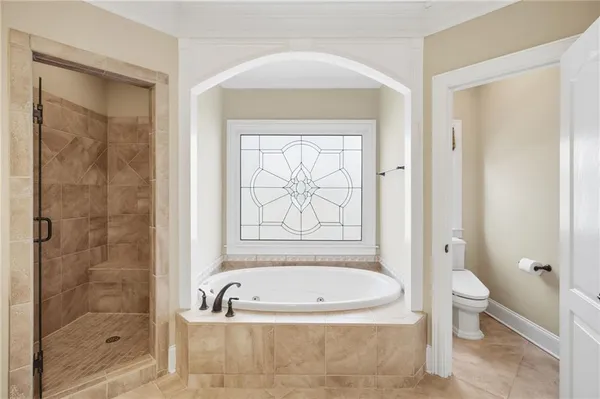 a view of a brick house with many windows