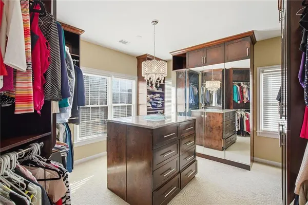 a view of a chairs and table on the balcony