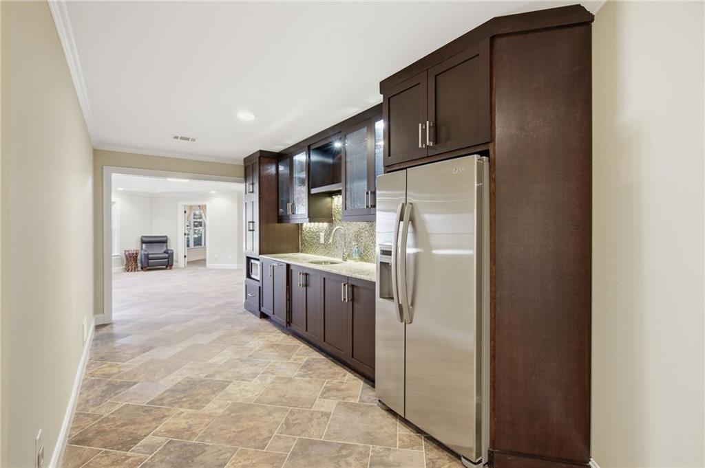 715 Crown Cove Milton, GA 30004 - Photo 42 of 102 a kitchen with stainless steel appliances granite countertop a refrigerator and a stove
