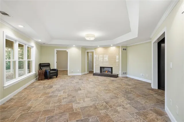 a view of a house with sitting area and garden