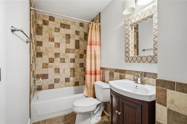 a view of a swimming pool with a lawn chairs and potted plants