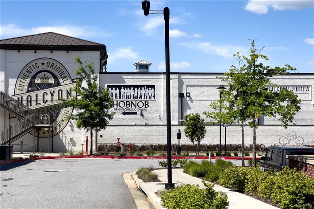 715 Crown Cove Milton, GA 30004 - Photo 100 of 102 a front view of a house with garden