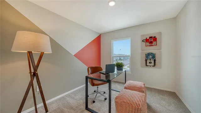 a living room with furniture and a rug