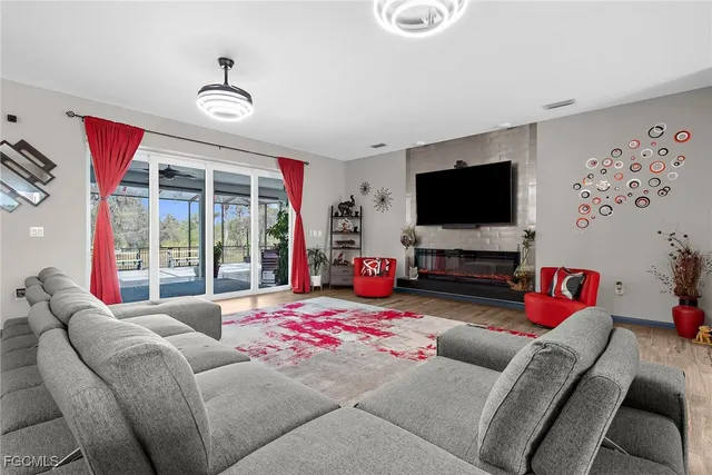 a bedroom with furniture and a flat screen tv