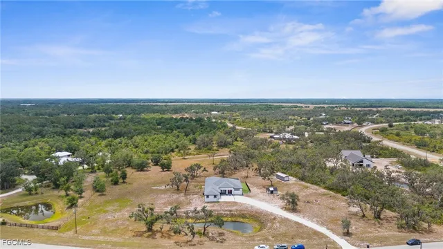 an aerial view of residential building and lake