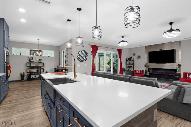 a view of a livingroom with furniture and hardwood floor