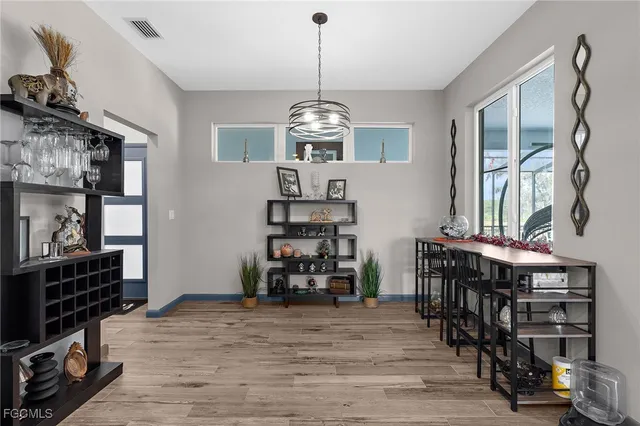 a bedroom with a bed and flat screen tv