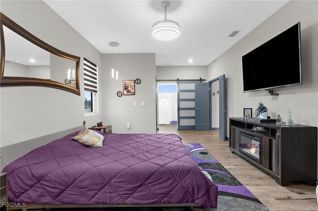 a view of walk in closet with clothes