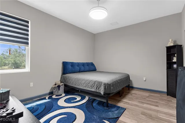 a bathroom with a sink vanity mirror and toilet