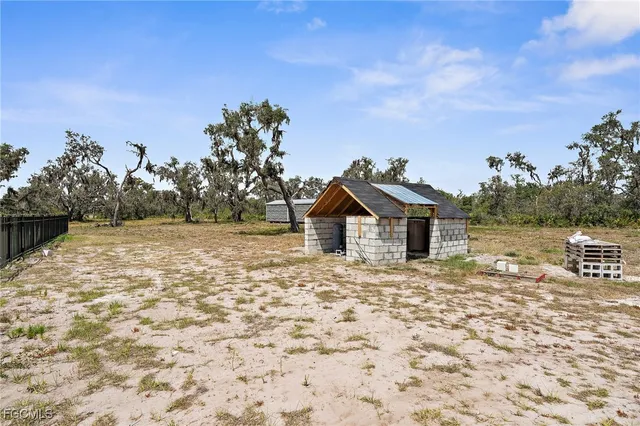 a view of a back yard of the house
