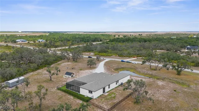 an aerial view of a house with lake view