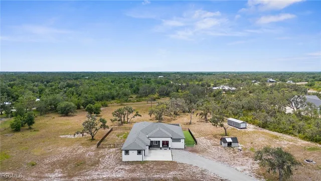 a house with swimming pool in front of it