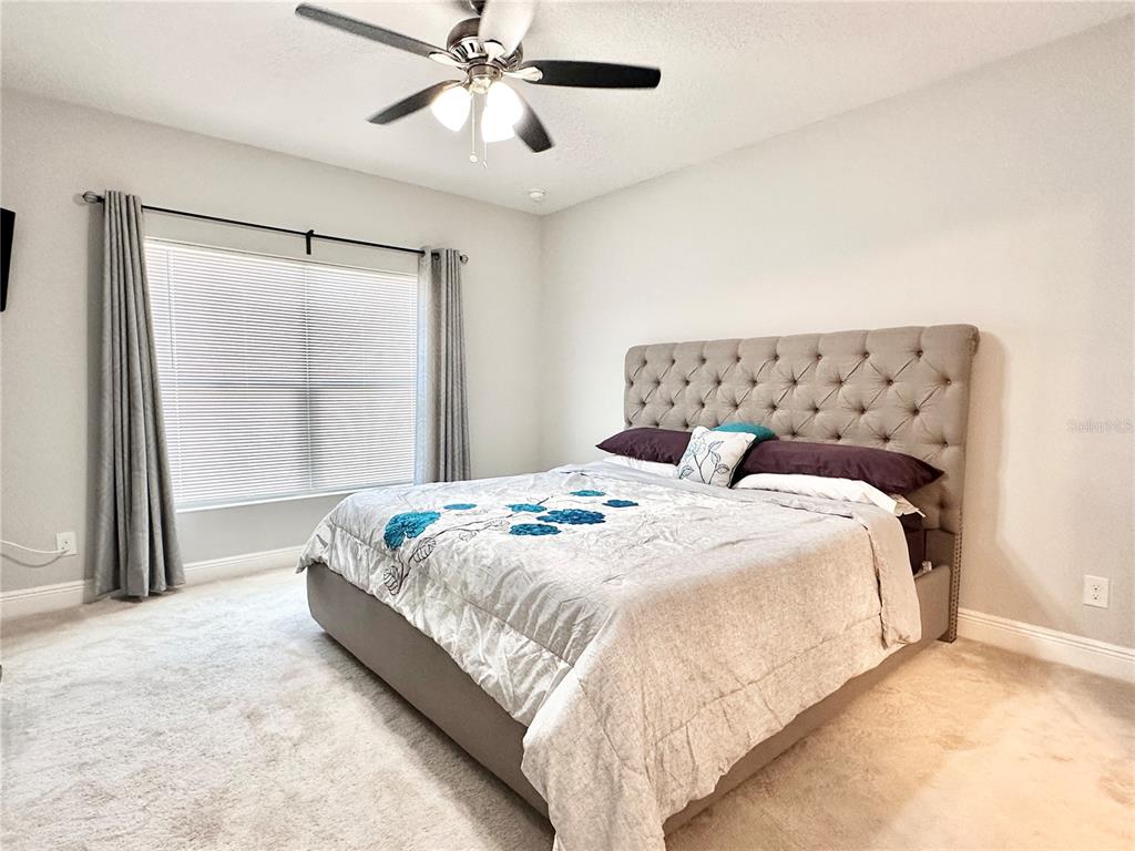 207 Petosky Road Groveland, FL 34736 - Photo 11 of 21 a bedroom with a bed and a window