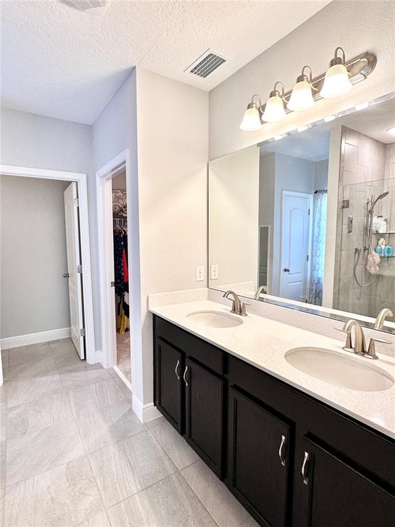 207 Petosky Road Groveland, FL 34736 - Photo 13 of 21 a bathroom with a sink double vanity and a mirror