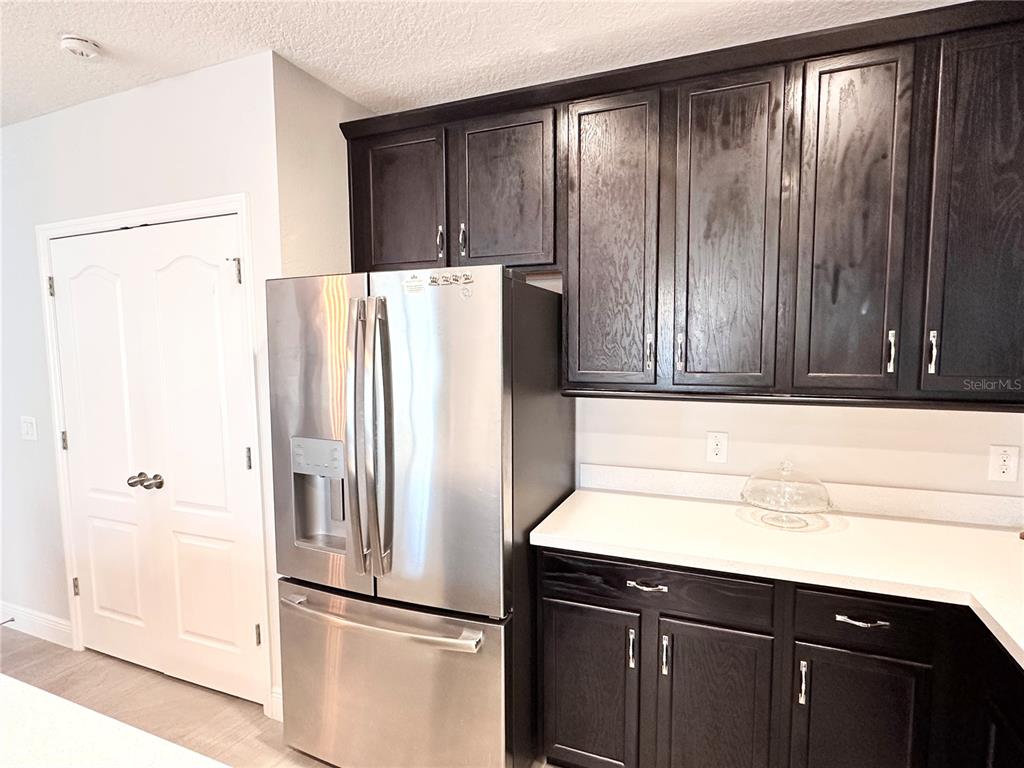 207 Petosky Road Groveland, FL 34736 - Photo 6 of 21 a kitchen with a refrigerator and a sink