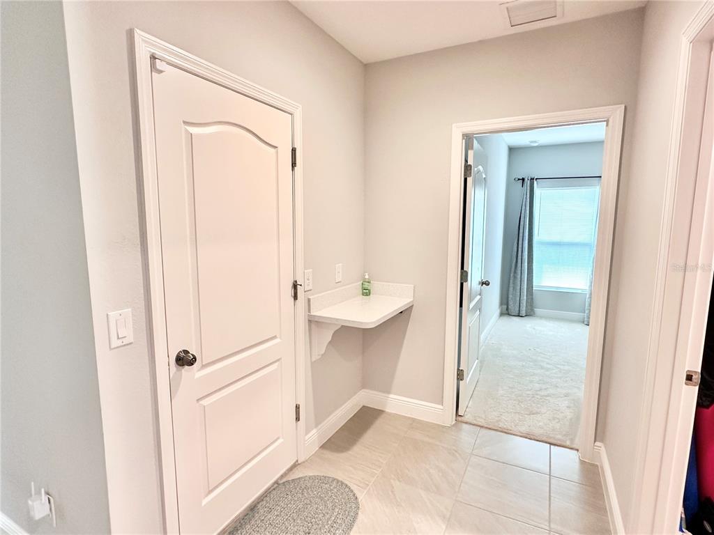 207 Petosky Road Groveland, FL 34736 - Photo 10 of 21 a view of a bathroom from the hallway