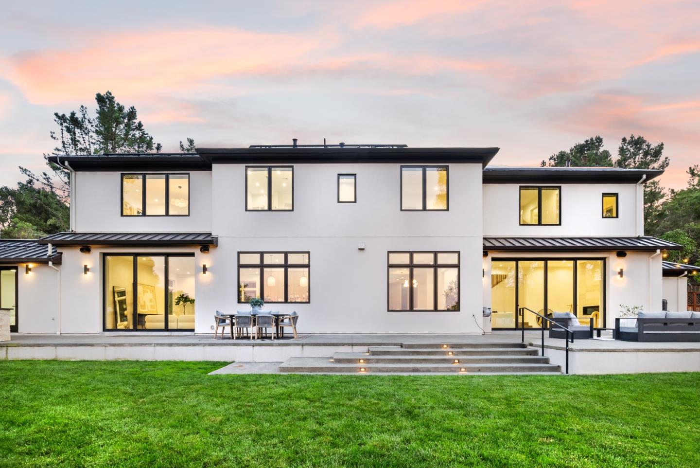 a front view of house with a garden