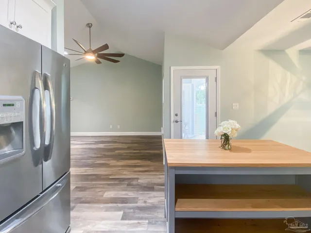 a bathroom with a sink a mirror and shower