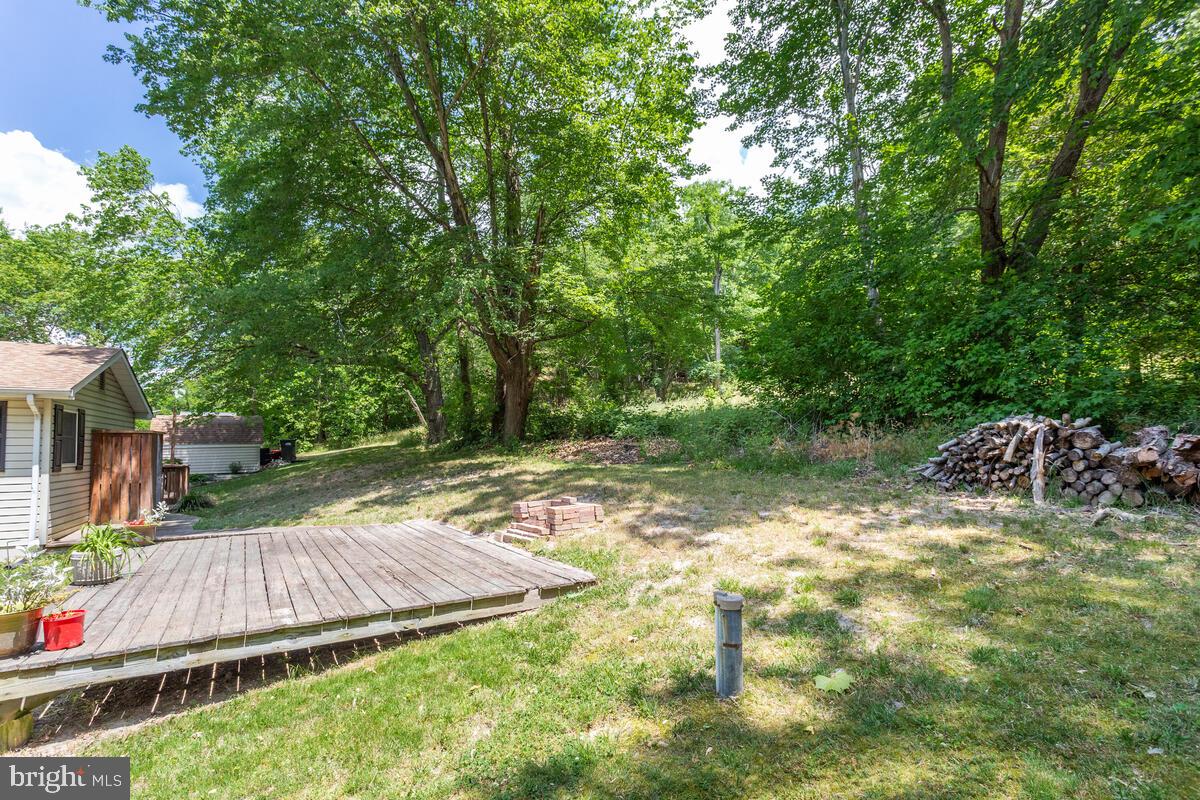 1260 Coster Road Lusby, MD 20657 - Photo 43 of 46 a view of backyard with swimming pool and outdoor seating