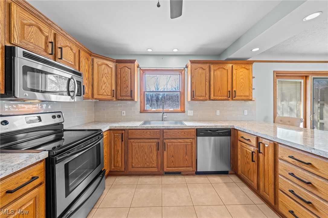 5926 Dailey Road New Franklin, OH 44319 - Photo 23 of 50 The 2nd level boasts a large kitchen with ceramic floors, formica counters,