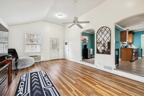 a view of a livingroom with furniture and wooden floor