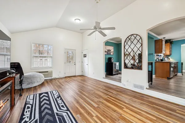 a view of a livingroom with furniture and wooden floor