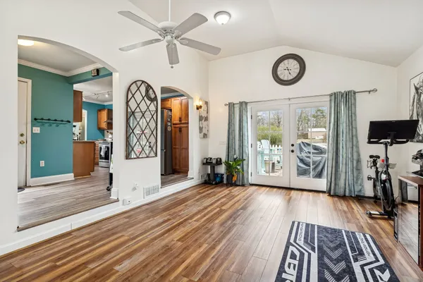 a view of a room with wooden floor