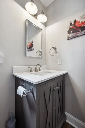 a bathroom with a sink vanity and a mirror