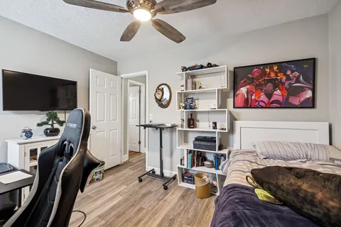 a view of a livingroom with workspace and a window