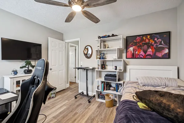 a view of a livingroom with workspace and a window