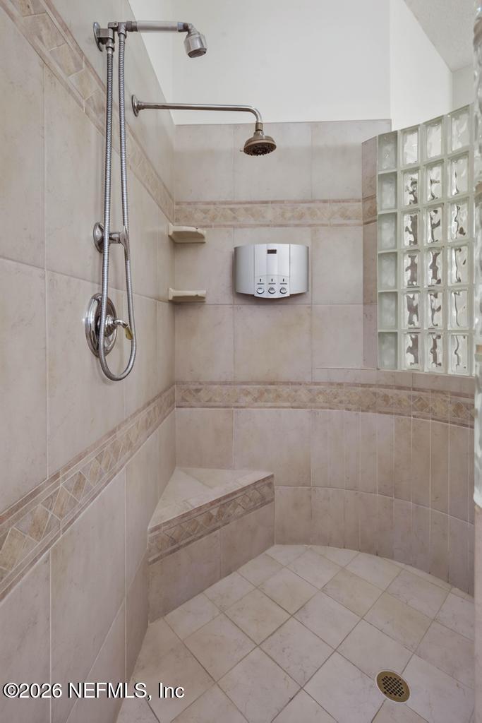 1483 Bridgette Way Fleming Island, FL 32003 - Photo 43 of 63 a bathroom with a shower