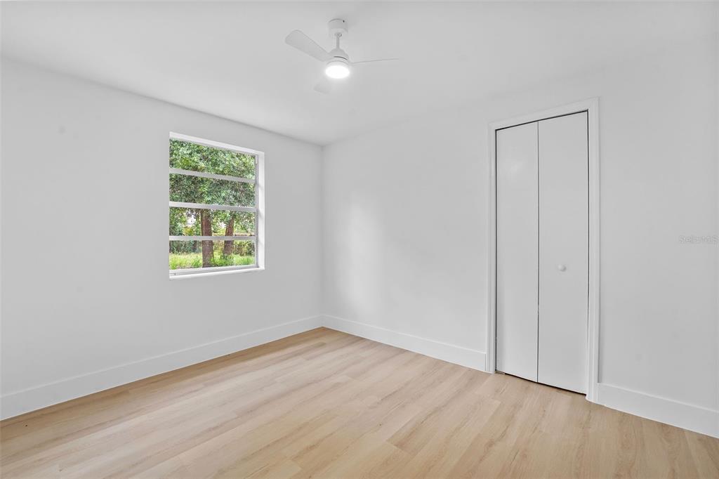 17 Palmira Road DeBary, FL 32713 - Photo 23 of 28 an empty room with wooden floor and windows
