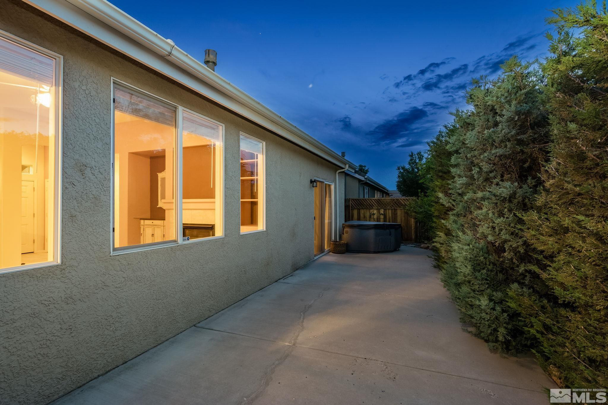1439 Gaucho Lane Reno, NV 89521 - Photo 31 of 40 a view of a house with backyard and trees