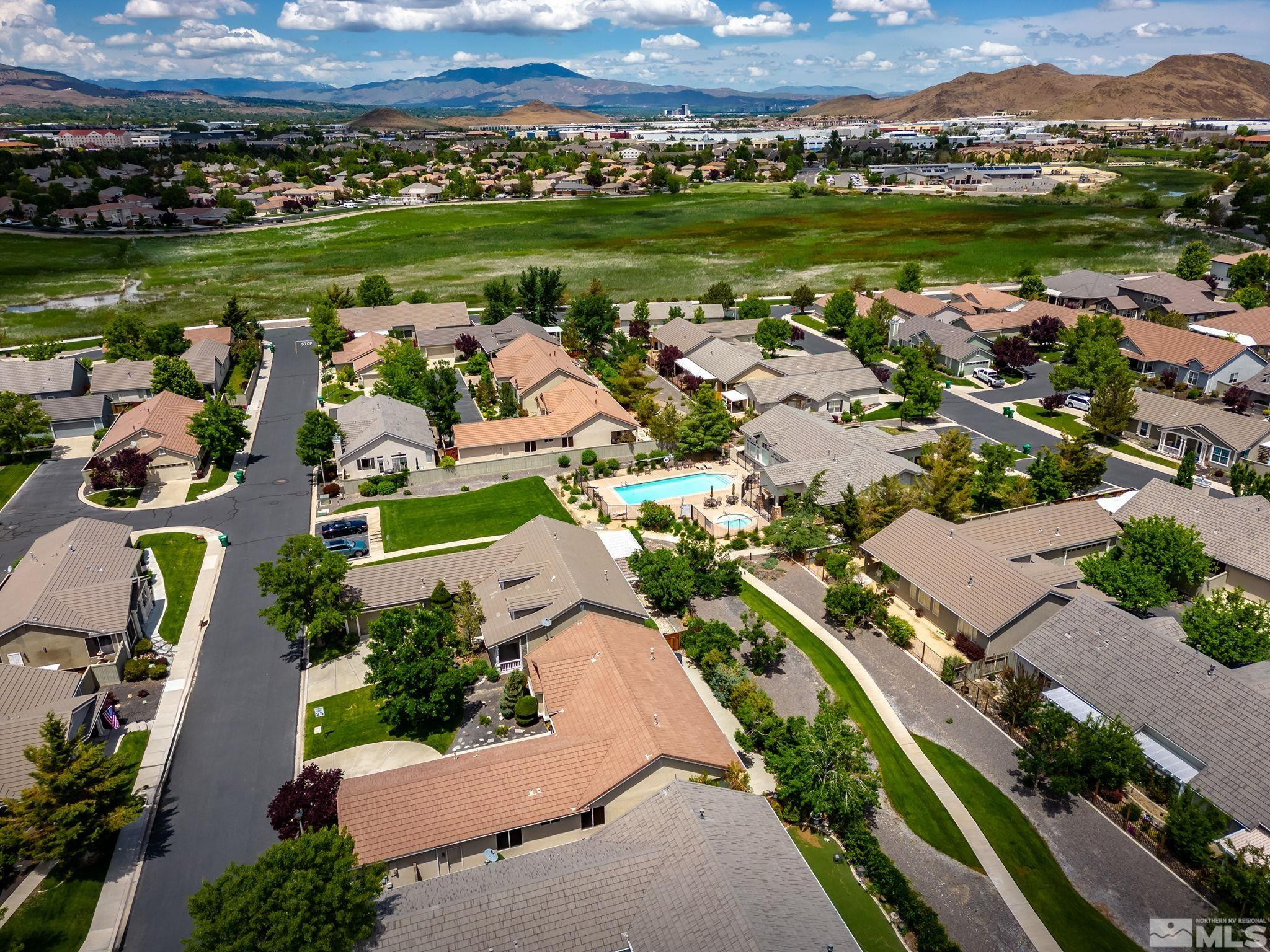 1439 Gaucho Lane Reno, NV 89521 - Photo 39 of 40 an aerial view of a city with lots of residential buildings and mountain view in back