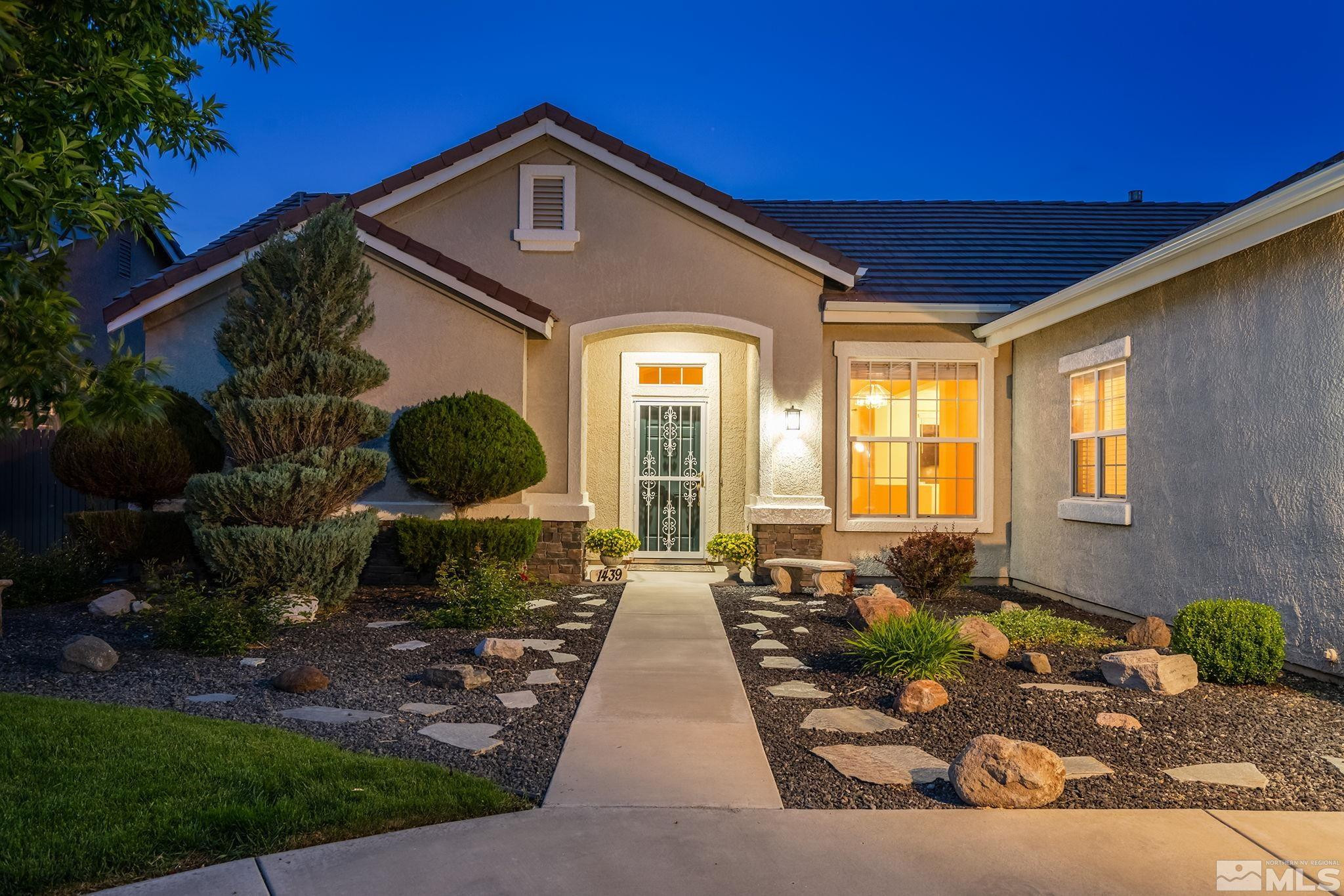 1439 Gaucho Lane Reno, NV 89521 - Photo 5 of 40 a front view of a house with garden