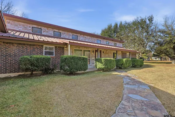 front view of a house with a yard